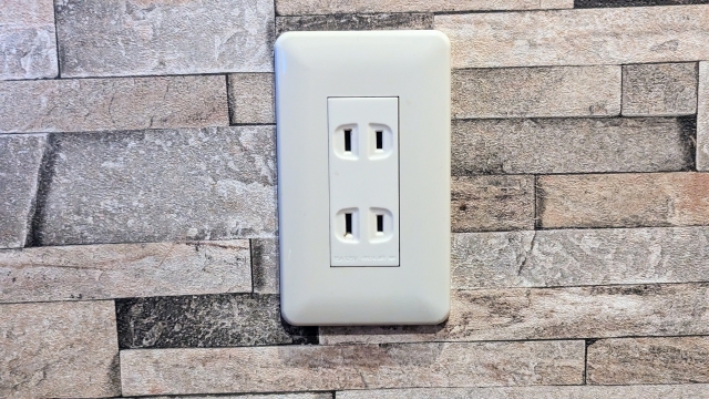 A picture resembling a household electrical outlet.